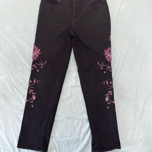 Black skinny jeans. With purple floral embroidery. Size 29.